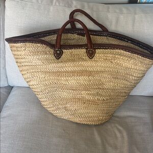 Source Unknown Tan and Brown Woven Tote from Mexico, leather handles, and trim.